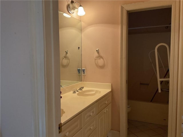 bathroom with tile patterned floors, vanity, and toilet