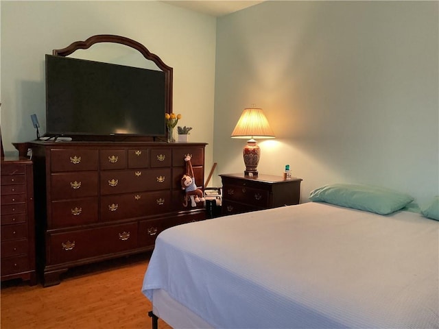 bedroom with light wood-type flooring