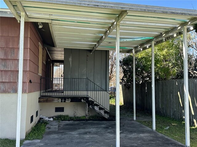 view of parking / parking lot featuring a carport