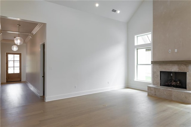 5044 Twin River Pl, Covington, LA 70433 - unfurnished living room featuring wood finished floors, baseboards, plenty of natural light, high vaulted ceiling, and recessed lighting