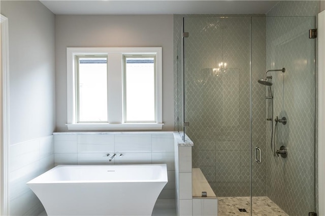 5044 Twin River Pl, Covington, LA 70433 - full bath featuring a freestanding bath, a shower stall, and tile walls