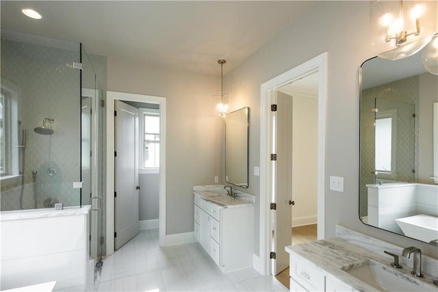 5044 Twin River Pl, Covington, LA 70433 - full bathroom featuring a shower stall, a chandelier, two vanities, baseboards, and a bath
