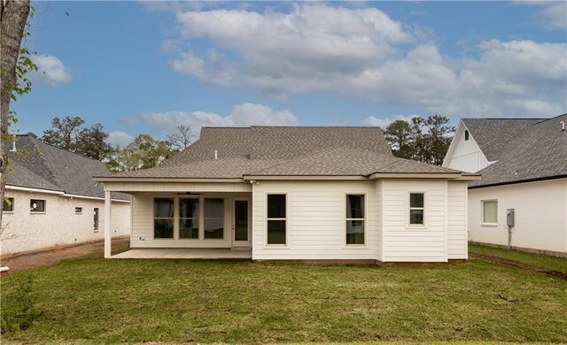 5044 Twin River Pl, Covington, LA 70433 - rear view of property featuring a patio, a lawn, and a shingled roof