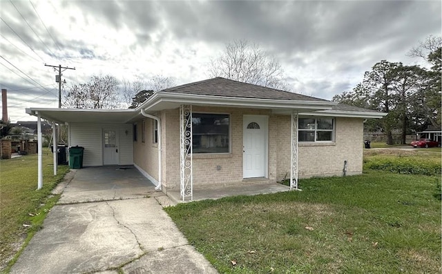 bungalow-style home featuring a front yard and a carport