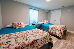 bedroom featuring wood-type flooring