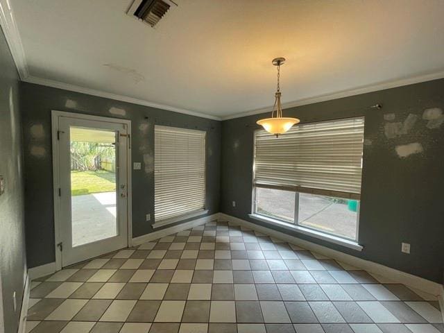 interior space with ornamental molding, tile patterned floors, visible vents, and baseboards