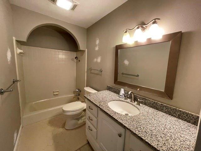 full bathroom with toilet, vanity, tile patterned floors, and  shower combination