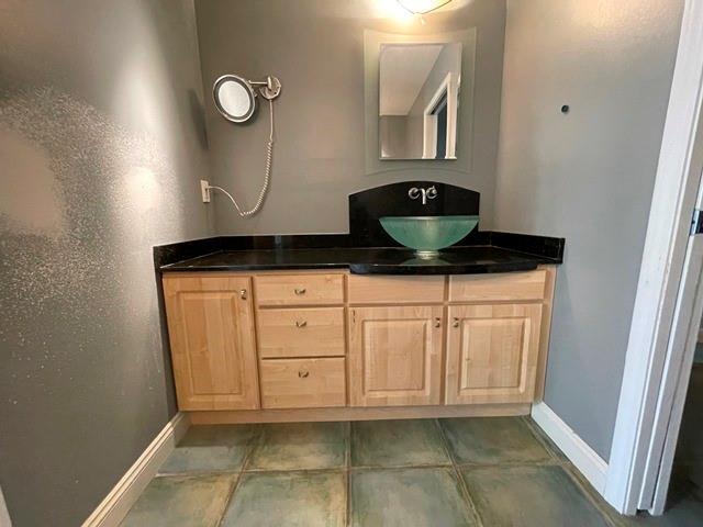 bathroom with vanity and tile patterned floors