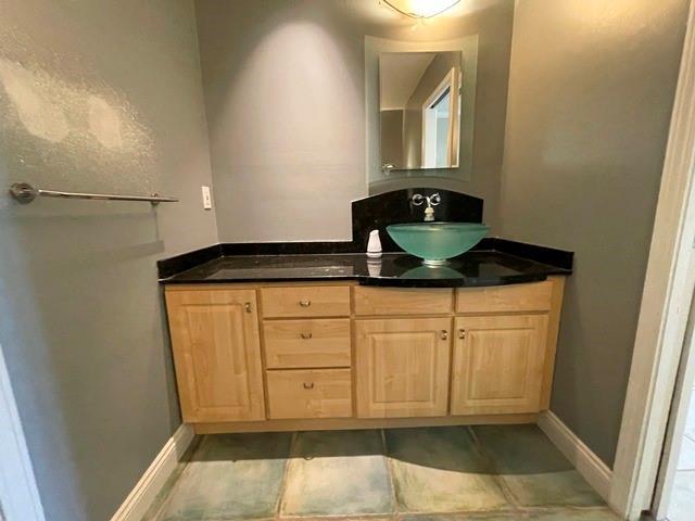 bathroom with vanity and tile patterned floors