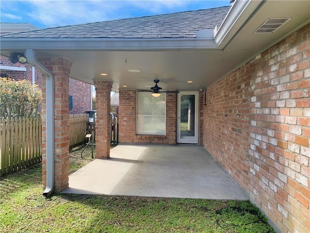 view of patio / terrace featuring ceiling fan, visible vents, and fence