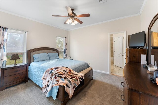 bedroom featuring ceiling fan, crown molding, connected bathroom, and light colored carpet