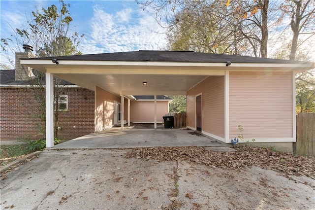 view of parking / parking lot with a carport