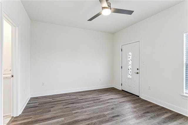 entryway with ceiling fan, wood finished floors, and baseboards