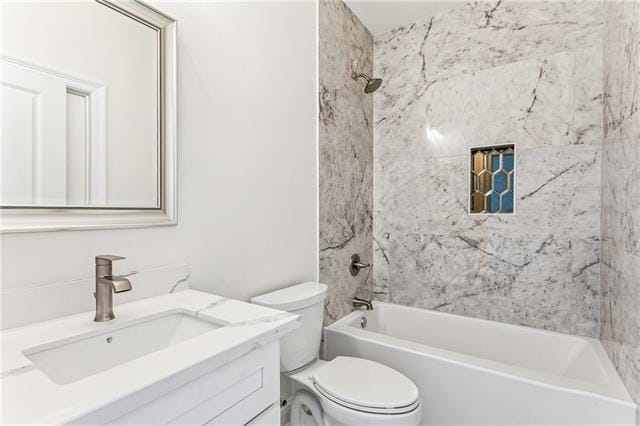 full bathroom featuring bathtub / shower combination, vanity, and toilet