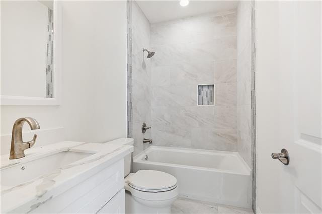 bathroom featuring toilet, shower / tub combination, and vanity