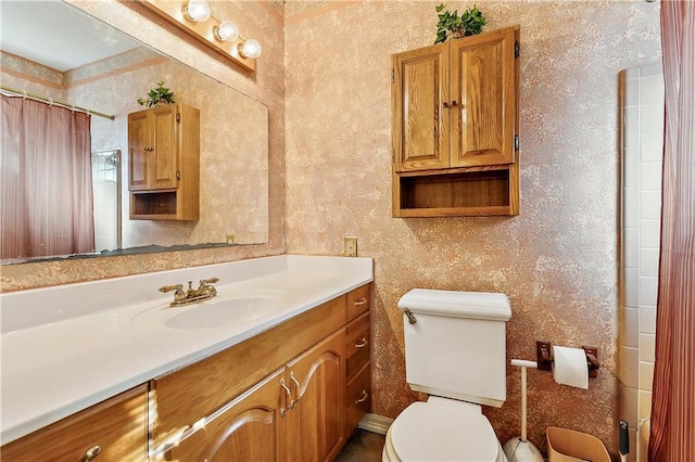 bathroom featuring toilet, a shower with curtain, and vanity