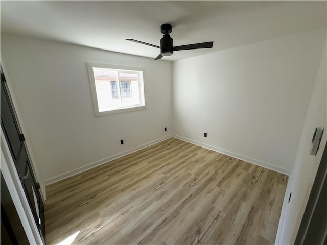 unfurnished room with ceiling fan and light hardwood / wood-style floors