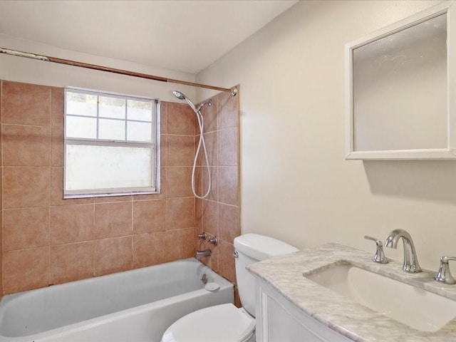 full bathroom featuring vanity, toilet, and tiled shower / bath combo