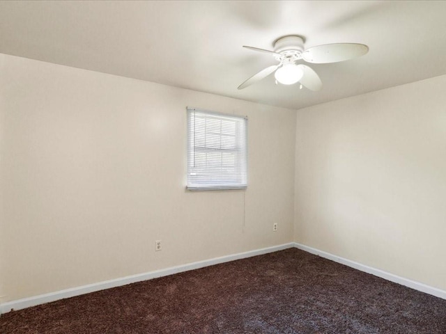 spare room featuring carpet floors and ceiling fan