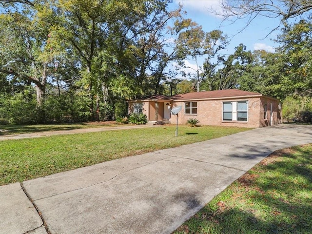 ranch-style house with a front lawn