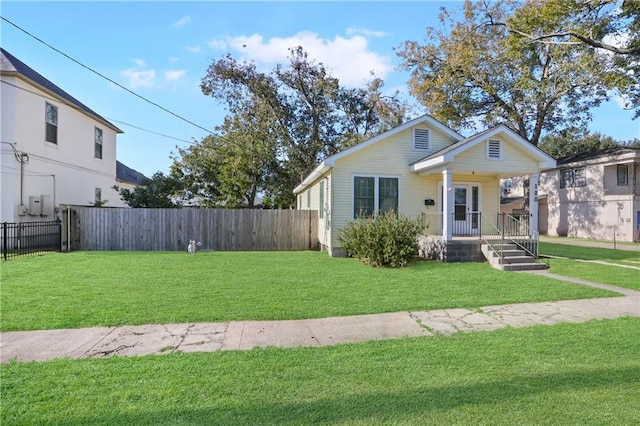 view of front of property with a front yard and a porch