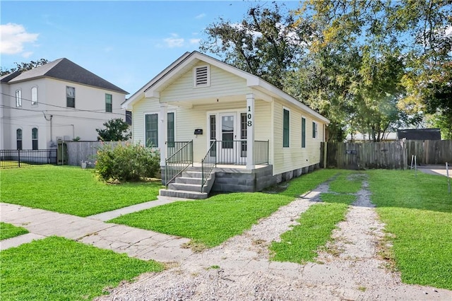 bungalow-style house with a front yard