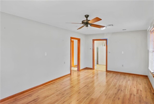 unfurnished room featuring light hardwood / wood-style floors and ceiling fan