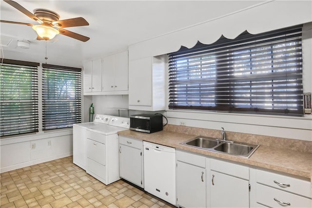 kitchen featuring white cabinets, dishwasher, sink, and washer / dryer