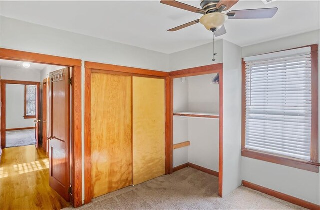 unfurnished bedroom with light carpet and ceiling fan