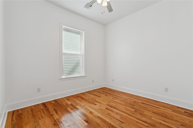 empty room featuring ceiling fan and light wood-type flooring