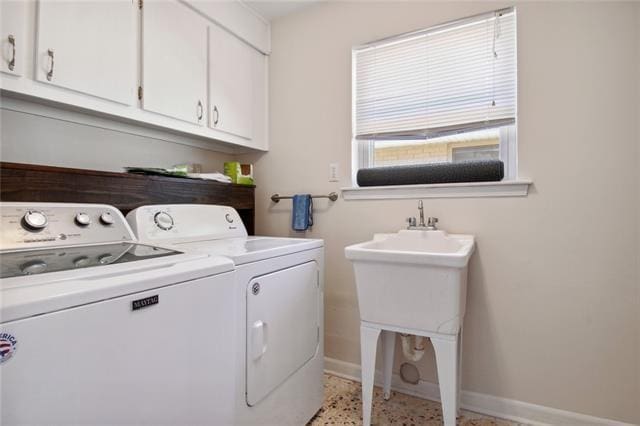 laundry room with cabinets and independent washer and dryer