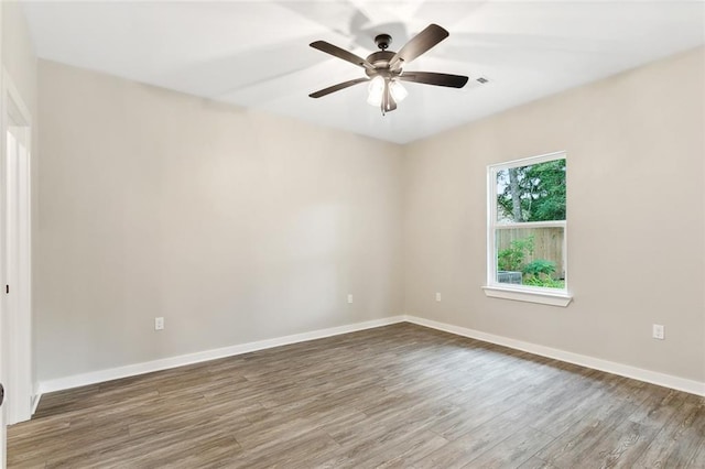 unfurnished room featuring ceiling fan and hardwood / wood-style floors