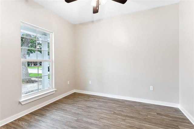 unfurnished room featuring ceiling fan and hardwood / wood-style floors