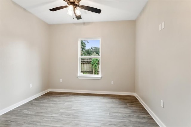 empty room with ceiling fan and wood-type flooring