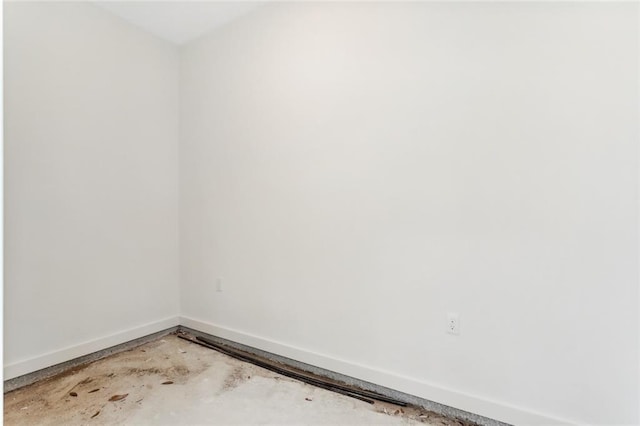 spare room featuring concrete floors