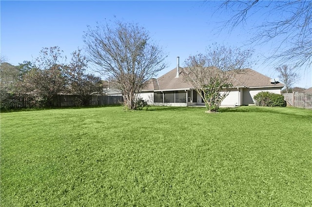 view of yard featuring a sunroom