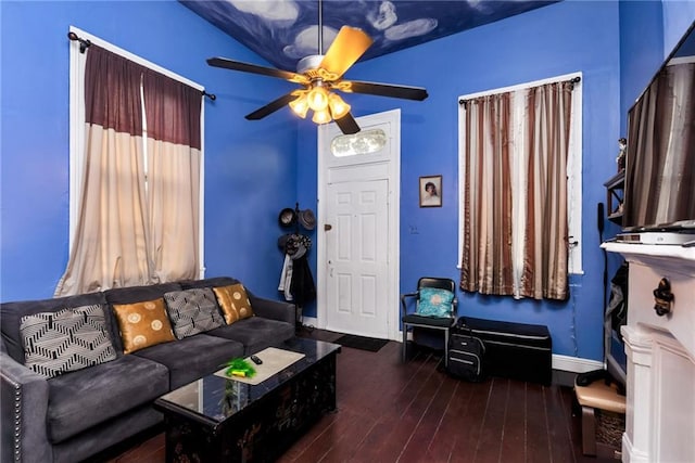 living room with ceiling fan, dark wood-type flooring, and lofted ceiling