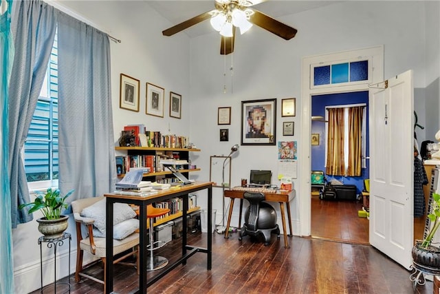 office space featuring ceiling fan and dark hardwood / wood-style flooring