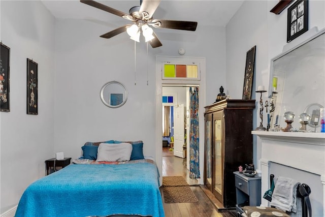 bedroom featuring ceiling fan and hardwood / wood-style flooring