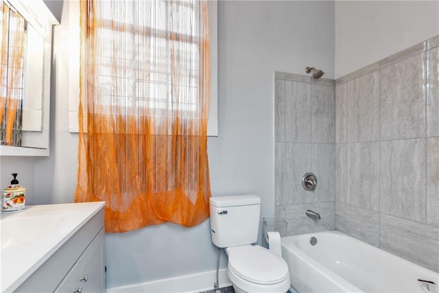 full bathroom featuring shower / tub combination, vanity, and toilet