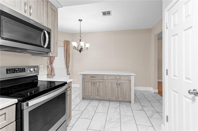 kitchen with stainless steel appliances, light brown cabinets, hanging light fixtures, and a notable chandelier