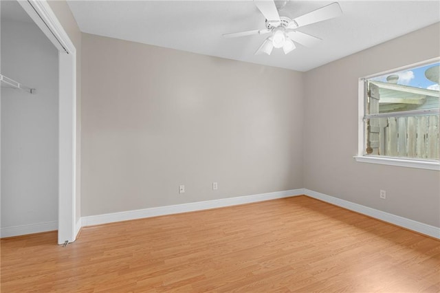 unfurnished bedroom with ceiling fan, a closet, and light hardwood / wood-style flooring