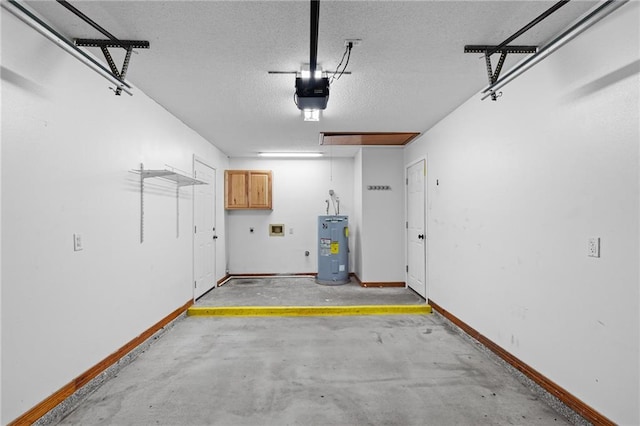 garage featuring electric water heater and a garage door opener