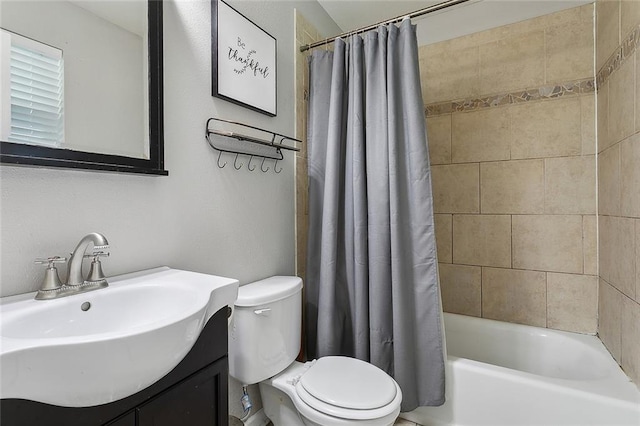 full bathroom featuring toilet, vanity, and shower / bath combo