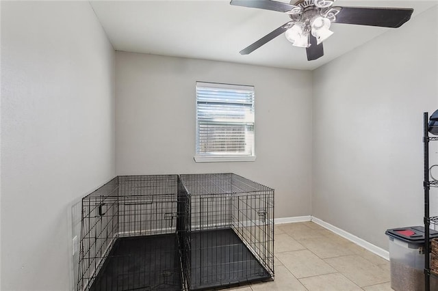 interior space featuring ceiling fan and light tile patterned floors