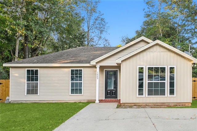 single story home featuring a patio and a front lawn