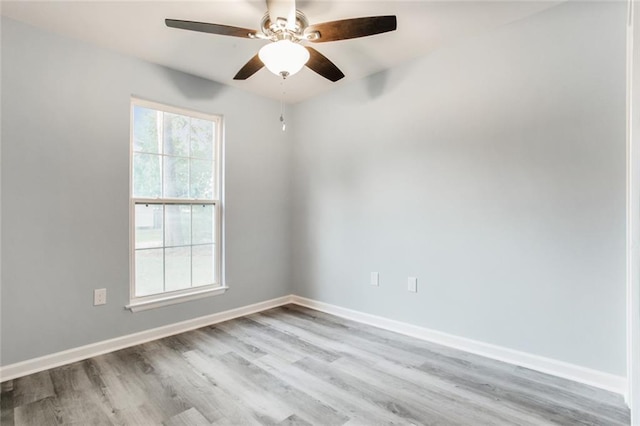 spare room featuring ceiling fan and light hardwood / wood-style flooring