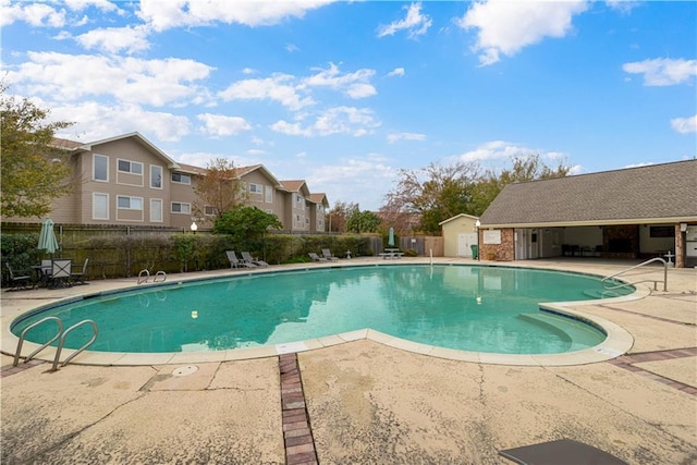 view of swimming pool featuring a patio