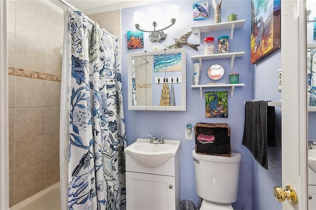 full bathroom featuring toilet, ornamental molding, vanity, and shower / tub combo with curtain