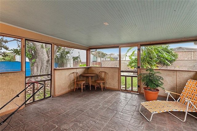 sunroom with plenty of natural light